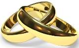 Cómo se dice two intertwined gold wedding bands en español?  el aniversario el día