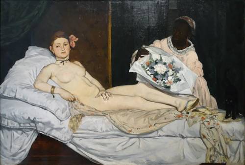 The controversial image by edouard manet was entitled  a. masquerade c. olympia b. the son of man d.