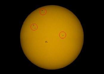 Study the circled features on the surface of the sun. the circled areas are called . they are the su