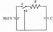 In the circuit, R = 21 kΩ and C = 0.56 μF. The capacitor is allowed to charge fully and then the swi