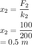 x_2=\dfrac{F_2}{k_2}\\\\x_2=\dfrac{100}{200}\\=0.5\ m