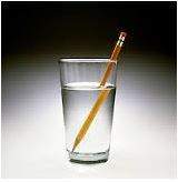Why does the pencil appear broken in the cup of water?  a question 4 options