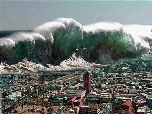 Describe a tsunami when it is far from the coast