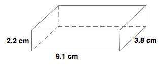 The scale drawing of a concrete pad has a length of 9.1 cm, a depth of 2.2 cm and a width of 3.8 cm.