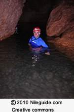 The picture below shows a person exploring an underwater cave in florida. the underwater
