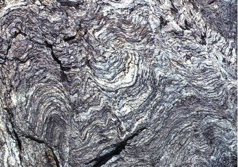 The image above shows a type of metamorphic rock called gneiss. Gneiss is characterized by alternati