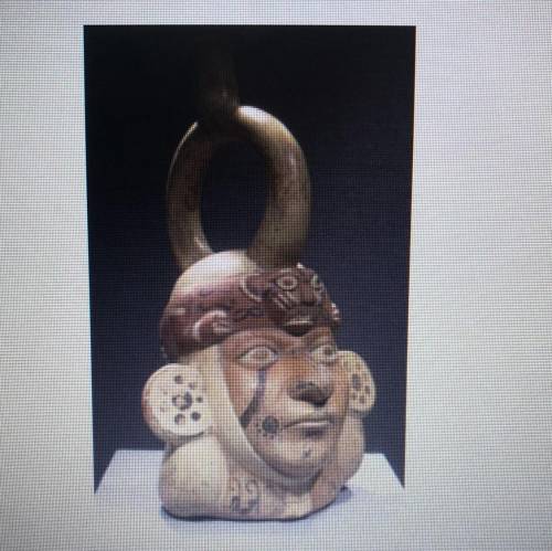 Look at this photograph. This sculpture of a warrior's head was produced in a. india b. north americ