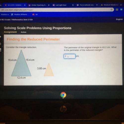 The perimeter of the original triangle is for43.2 cm What is the perimeter of the reduced triangle