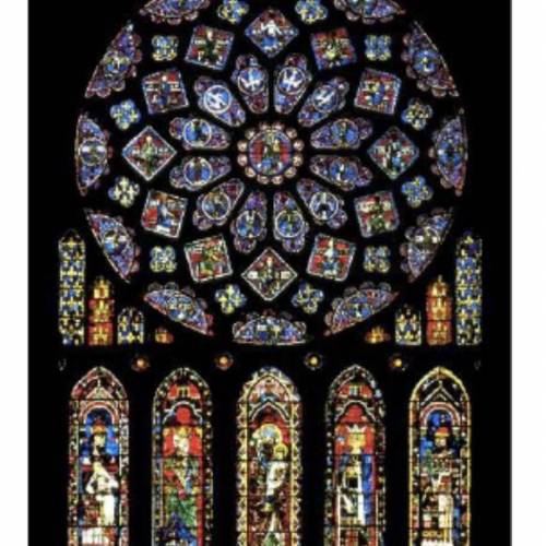 Answer in 3-4 complete sentences.

(a large stained glass rose window above five panels of colorfu