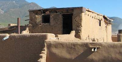 The image depicts a Pueblo dwelling found in the American Southwest. Pueblo construction was most l