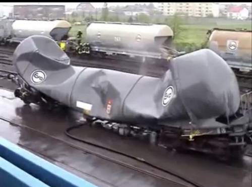 A train crew was cleaning out a rail tanker that had been emptied of its contents. They rinsed the