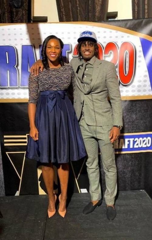 Do yall know him from the NBA draft yesterday? and this is my Godmother with hi.