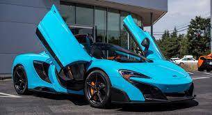 WHICH CAR IS BETTER
THE BLUE AND GOLD ONE IS A ROLLS ROYCE
THE BLUE ONLY ONE IS A MCLAREN