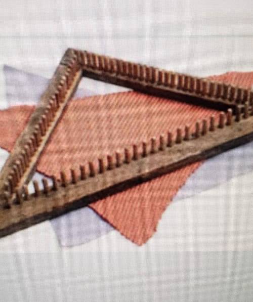 the triangle Loom is made from wood strips shaped into a 45 45 90 triangle. pegs are placed every h