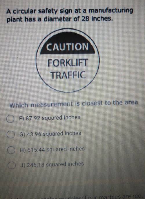 A circular safety sign at a manufacturing plant has a diameter of 28 inches. CAUTION FORKLIFT TRAFF