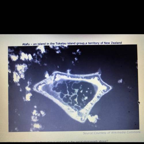 Which kind of geographic formation is pictured in the aerial photograph above

Atoll 
Isthumus 
Ba