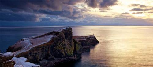 Skye is a beautiful island off west _ of Scotland​