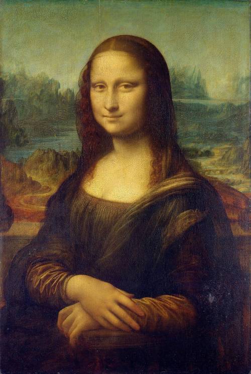 The Mona Lisa

What inspired Da Vinci to paint The Mona Lisa? Was she a real person? Or part of hi