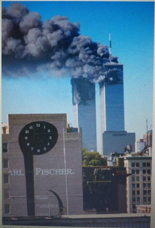 This image shows the World Trade Center in New York City, New York, after planes flew into the towe