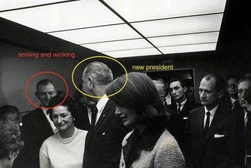 This photo was taken 2 hours after John f Kennedy the man that is circled actually happy for the pr