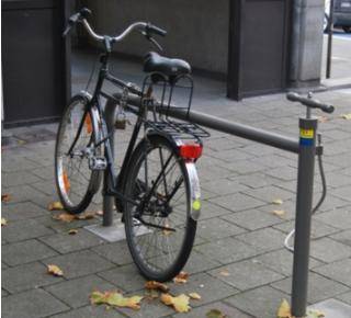 What makes the item in this photo clever? It keeps bicycles from being stolen. It allows riders to