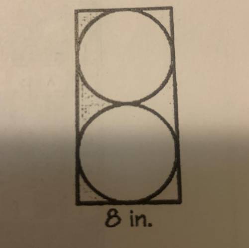 Find the area outside the circles but inside the rectangle of the figure to the right