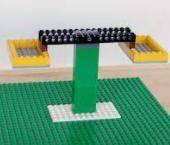 using Lego's, built a structure that is balanced and symmetrical. Photograph it. pls just show me a